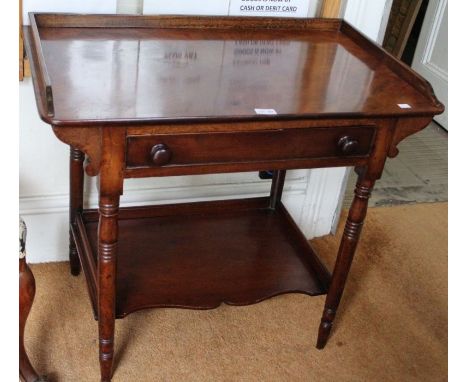 A Victorian flamed mahogany side table with single draw ring turned leg and galleried under tier 