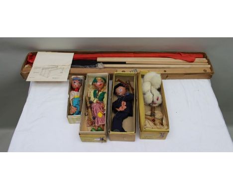 A Pelham puppet light weight theatre boxed together with two standard puppets boxed with a junior control boxed and jumpettes