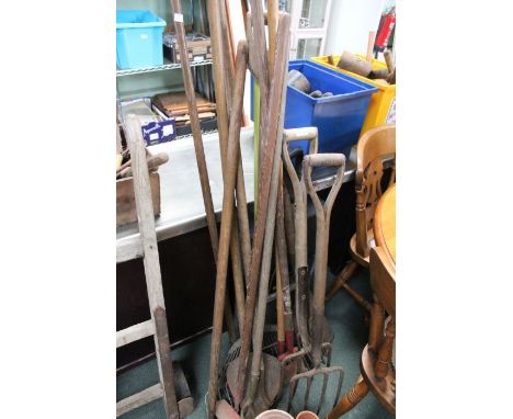 Selection of garden tools, spades, rakes, etc