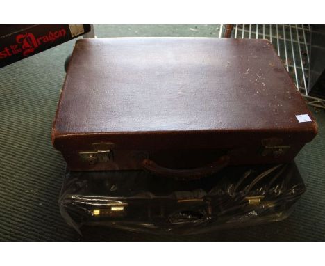 A vintage briefcase together with a new and un-used example 