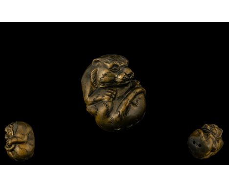Oriental Boxwood Netsuke in the form of a tiger. Please see accompanying image. Signed to base and in excellent condition