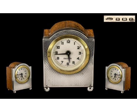 Mercedes Silver Faced &amp; Oak Case Bedroom/Desk Clock.  Features an engine turned silver front with gilt chapter ring.  Hal