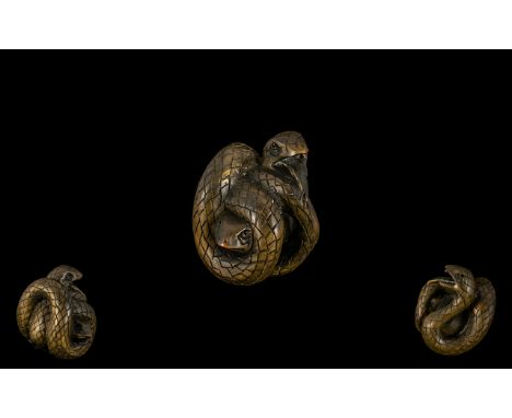 An Oriental Boxwood Netsuke in the form of a snake coiled around a frog. Signed to underneath. Excellent condition. Please se