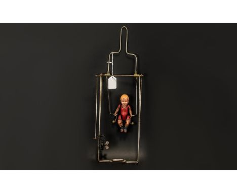 Japanese Automaton Celluloid Acrobatic Child on a clockwork iron frame.  Marked Japan Boku No Tonodachi.  Overall frame heigh