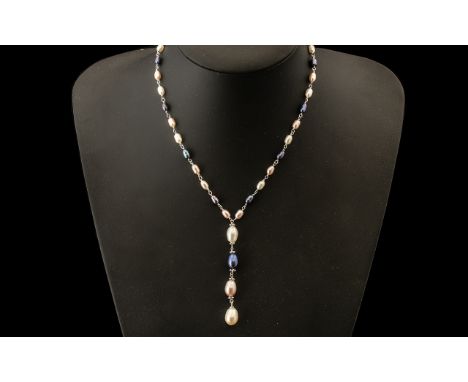 White, Peacock and Peach Fresh Water Pearl Y Shape Necklace, the main necklace composed of alternating colours of rice pearls