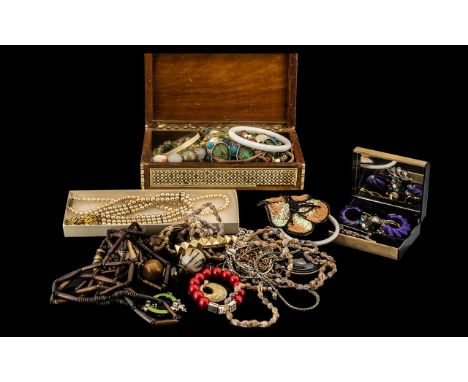 An Old Jewellery Box containing Vintage and Retro jewellery.  Comprising pearl necklaces; earrings, brooches and rings; a col