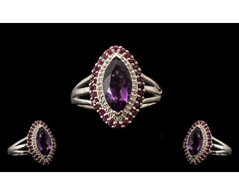 Amethyst, Ruby and White Topaz Marquise Shape Ring, a marquise cut, deep purple amethyst framed with sparkling round cut whit