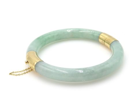 14ct gold jade hinged bangle, hallmarked Condition Report Approx 51.7gm, inner circumference = approx 18.5cmClick here for fu