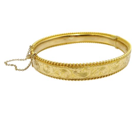 9ct gold bangle engraved decoration, Sheffield 1977, approx 17.42 gm Condition Report Inner circumference approx 18cm, good c