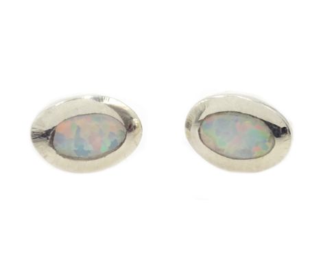 Pair of silver opal stud earrings, stamped 925 Condition Report Click here for further images, condition, auction times & del