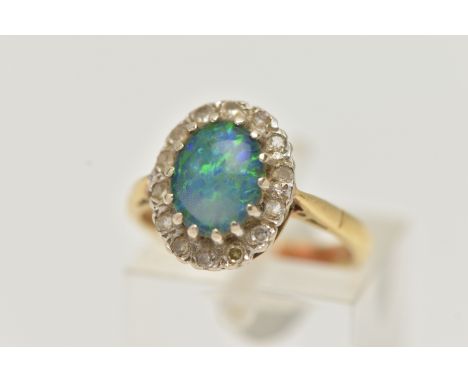 AN 18CT GOLD SYNTHETIC OPAL AND DIAMOND CLUSTER RING, the central oval synthetic opal cabochon within a single cut diamond su