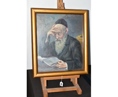 A MID 20TH CENTURY PORTRAIT OF A RABBI, a seated Rabbi is reading from a book, his glasses are perched upon the end of his no