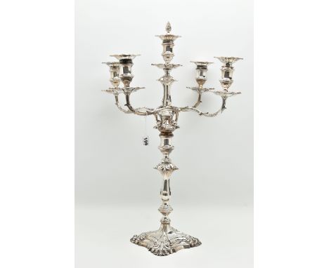 A GEORGE V SILVER FIVE LIGHT CANDELABRUM IN GEORGE II STYLE, with removable shaped square drip pans, waisted knopped stem, tw