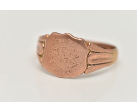 A GENTS 9CT ROSE GOLD SIGNET RING, engraved shield signet, textured shoulders leading onto a misshapen shank, hallmarked 9ct 