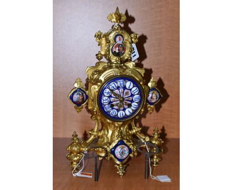 A LATE 19TH CENTURY GILT METAL AND PORCELAIN MOUNTED MANTEL CLOCK, the porcelain dial with Roman numerals, eight day movement