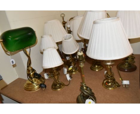 A QUANTITY OF ASSORTED BRASS TABLE AND DESK LAMPS, majority are have various candlestick type bases, not tested, majority wit