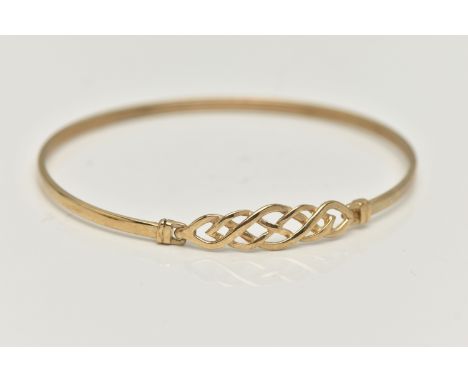 A 9CT GOLD BANGLE, a Celtic design light weight bangle, fitted with a hook fastening, hallmarked 9ct Birmingham, approximate 