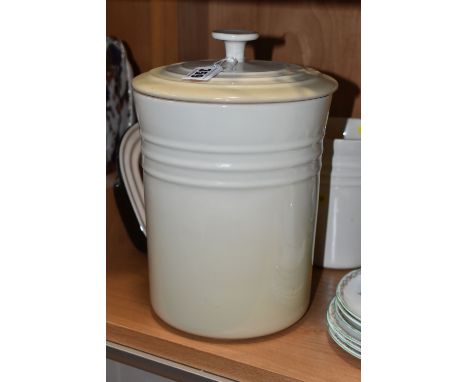 THREE PIECES OF LE CREUSET KITCHENWARE, comprising a black Le Creuset oven dish 13-28, a cream utensil jar 0908, and a large 