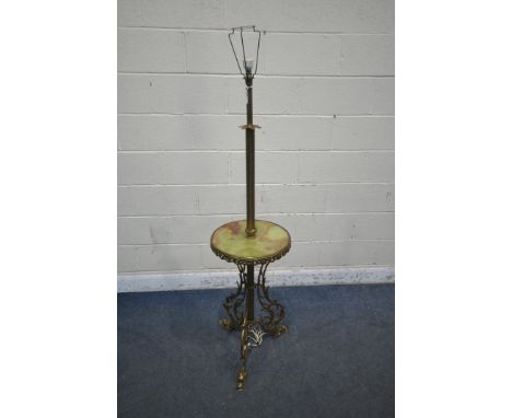 A FRENCH BRASS AND ONYX STANDARD LAMP, with a circular shelf, standing on triple foliate legs with mythical creature feet, he