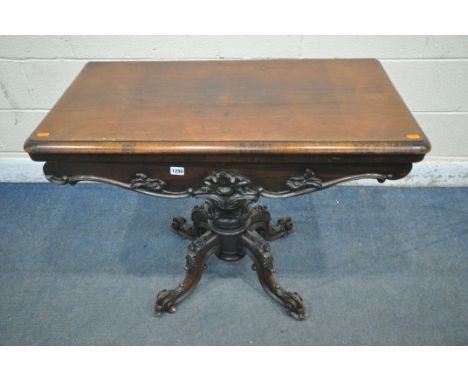 A VICTORIAN ROSEWOOD CARD TABLE, the twist and fold top enclosing a circular green baize playing surface, on a baluster suppo