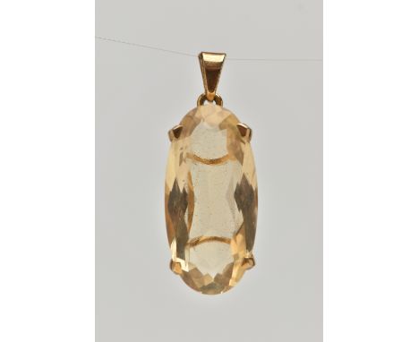 A 9CT GOLD CITRINE PENDANT, of an oval form, in a four claw setting, hallmarked 9ct London, fitted with a tapered bail, lengt