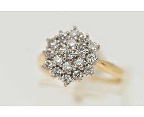 A YELLOW METAL DIAMOND CLUSTER RING, cluster set with round brilliant cut diamonds, estimated total diamond weight 0.55ct, ap