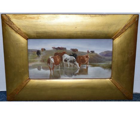 A LATE 19TH CENTURY GILT FRAMED PORCELAIN PLAQUE PAINTED WITH CATTLE WATERING, unsigned and unmarked, plaque 18cm x 36cm (Con