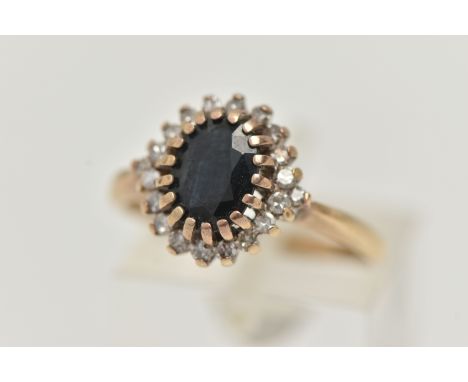 A 9CT GOLD SAPPHIRE AND DIAMOND CLUSTER RING, the central oval sapphire within a single cut diamond surround, 9ct hallmark fo