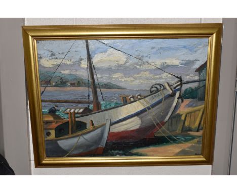 A 20TH CENTURY FISHING BOAT SCENE, two boats are beached at low tide while a male figure tends to the nets, a bay and landsca
