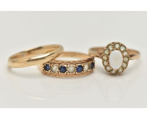 THREE 9CT GOLD GEM SET RINGS, to include an opal and colourless gem cluster ring, a seven stone sapphire and colourless gem r