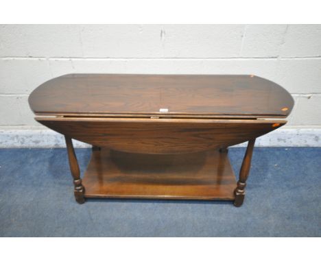 A REPRODUCTION OAK DROP LEAF COFFEE TABLE, on turned legs united by an undershelf, length 121cm x depth 52cm x height 55cm (c