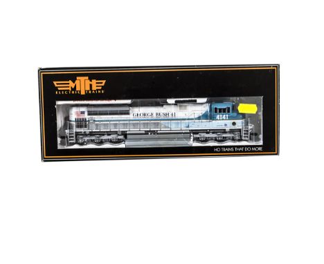 MTH American HO Gauge Diesel Locomotive, a boxed 80-2013-1 SD70ACE locomotive in blue and white livery George H Bush 4141, wi