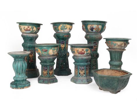 A GROUP OF SEVEN CERAMIC GARDEN POTS ON PLINTHS
The ceramic garden pots each with a green glaze, octagonal and round in form,