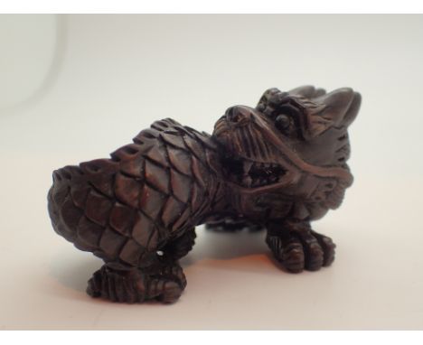 Signed wooden netsuke of a dragon 
