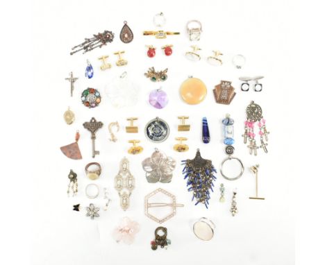 An assorted collection of costume jewellery. The lot to include; gold &amp; silver tone metal, cufflinks, necklace pendants, 