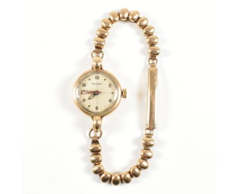 A hallmarked 9ct yellow gold Rotary Swiss made wrist watch. The watch having a cream circular dial with mixed dot &amp; Arabi