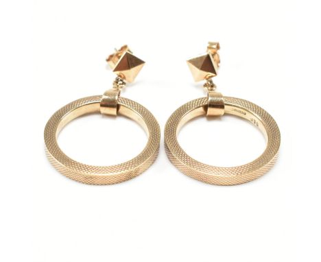 A pair of vintage hallmarked 9ct yellow gold stud drop earrings. The earrings having a square faceted head to straight post b