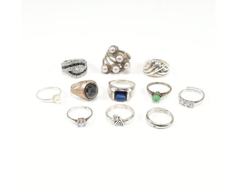 An assorted collection of silver rings. The lot to include a diamond &amp; 925 band ring, 925 pearl cluster ring, silver hema