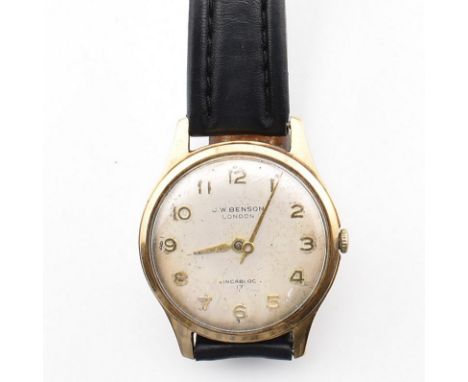 A hallmarked 9ct yellow gold J. W. Benson London wrist watch AF. The watch having a circular silvered dial with gold tone Ara