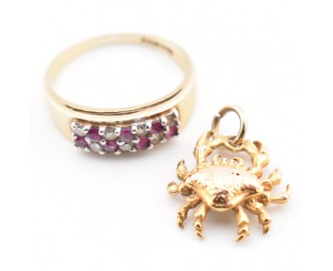 A hallmarked 9ct gold ring and crab pendant charm. A hallmarked 9ct gold half hoop ring set with ruby and diamond size J.5. A