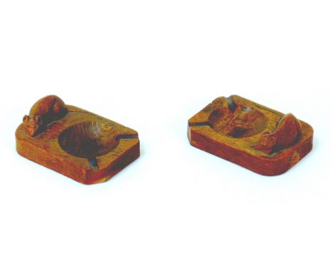 A pair of Robert 'Mouseman' Thompson carved oak ashtrays, both a carved mouse signature, one 10 by 7 by 4cm high, the other 1