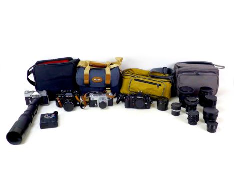 A collection of cameras and lenses, including a Nikon F-501 Af body, a Prinzflex 500 fitted with a Prinzgalaxy 1:6.3 f=400mm,