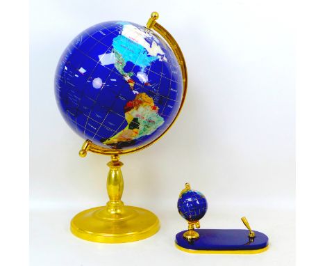 A semi-precious stone effect terrestrial globe, raised upon brass base, 29 by 56cm high, together with a pen stand with simil