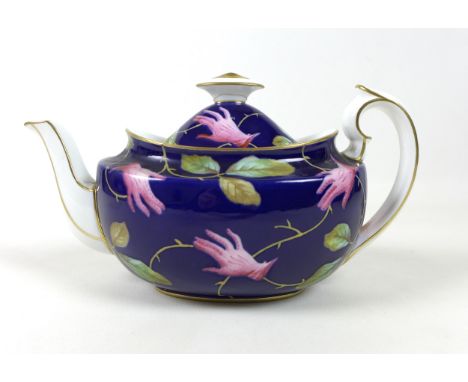 A Royal Crown Derby bone china teapot designed by Salvador Dali, circa 1939, the body painted in enamels with a design depict