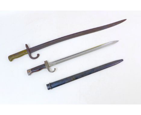 A late 19th century French 1866 model bayonet, with hooked quillons, brass grip, blade length 57.5cm long, overall length 69.