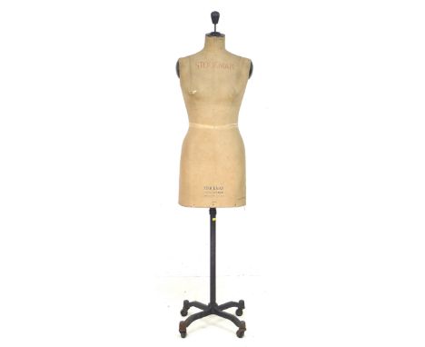 A vintage Stockman mannequin, on a cast iron base with four legs and castors, 46 by 46 by 160cm high. 