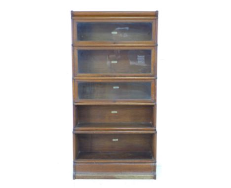 A Globe Wernicke bookcase, mid 20th century, in five graduating sections with fold away glazed doors, each having the maker's