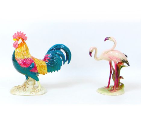 Two early to mid 20th century ceramic bird figurines, Comprising an Art Deco Keramos figural group of Flamingos, 16 by 9.5 by
