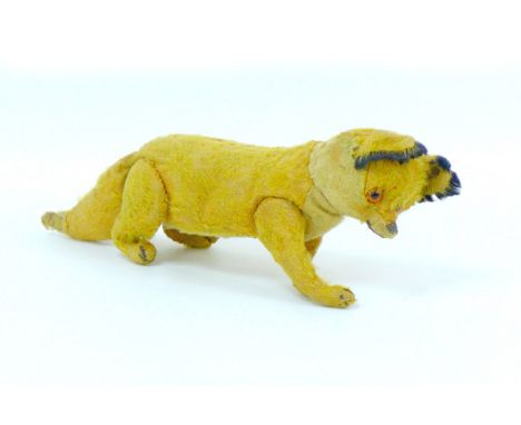 A vintage early 20th century Steiff soft toy fox, with Steiff stud to left ear, overall 29cm from tip of tail to snout, 10cm 