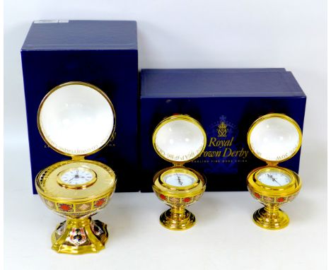 Three Royal Crown Derby paperweights, comprising a 'Millenium Globe Clock', 'Millenium Globe Barometer' and a 'Millenium Glob
